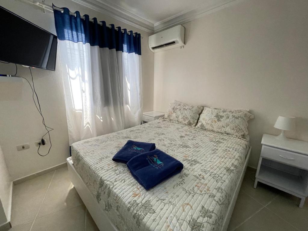 Postel nebo postele na pokoji v ubytování Karimar Beach Condo Hotel