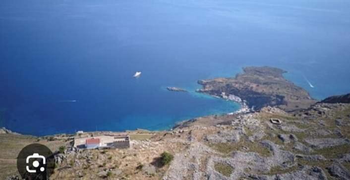a view of a mountain with a body of water at house FYNTIKAKH - SKALA in Anopoli Sfakion