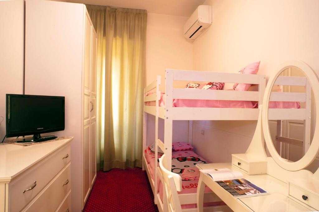 Postel nebo postele na pokoji v ubytování Family Room sul porticciolo