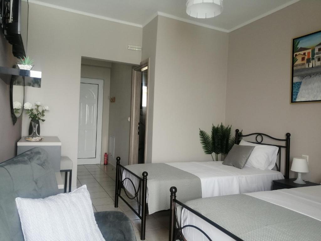 Postel nebo postele na pokoji v ubytování Anel Rooms