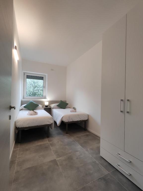 Letto o letti in una camera di Oasi degli Ulivi