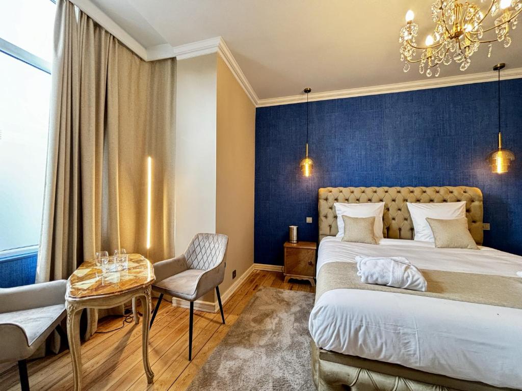 Postel nebo postele na pokoji v ubytování Maison du Roi