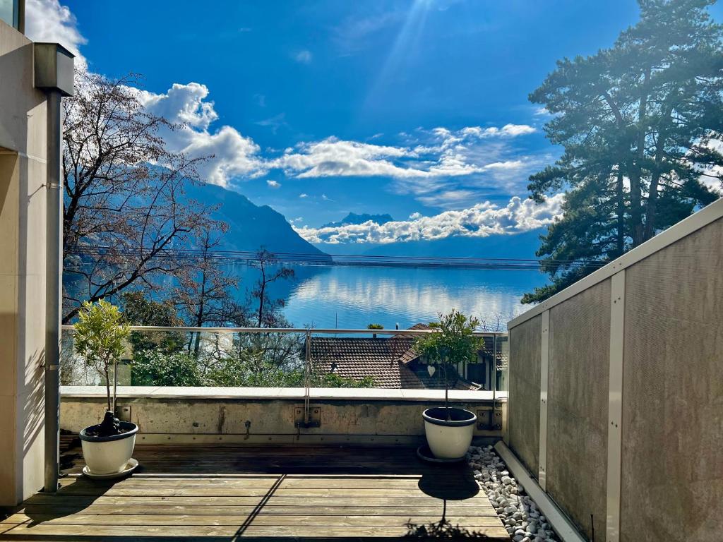 a balcony with a view of a lake at Spa luxury app for 2 or 4 pers centre lac view in Montreux