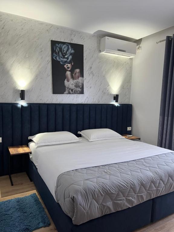 Postel nebo postele na pokoji v ubytování Hotel Floga