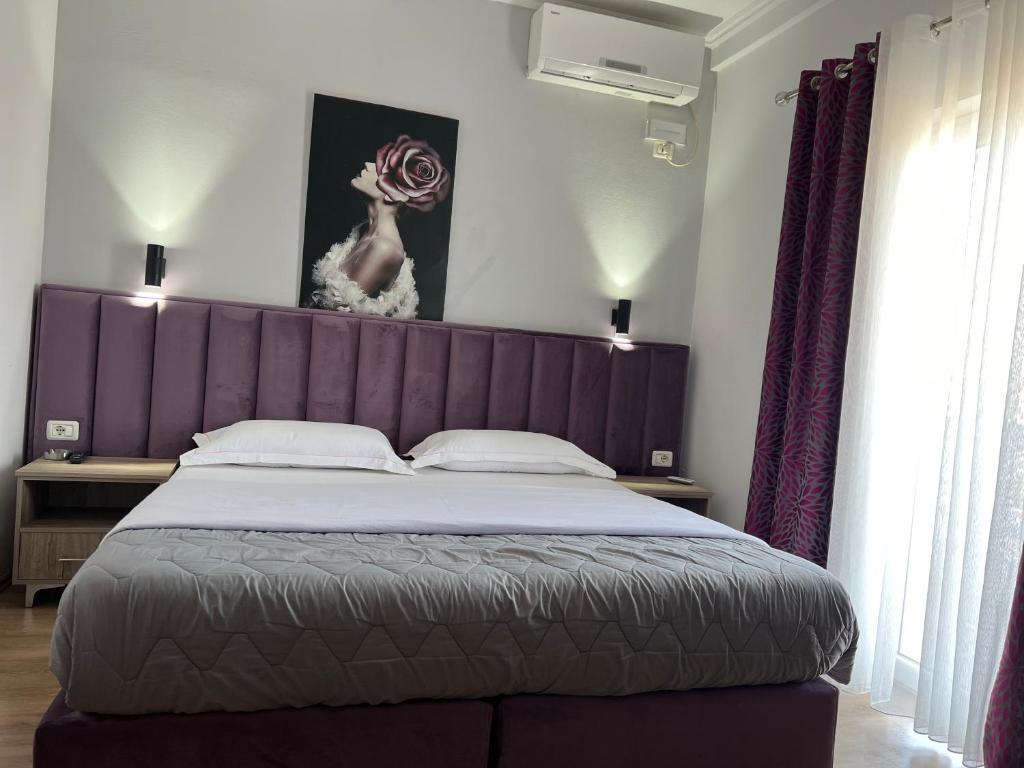 Postel nebo postele na pokoji v ubytování Hotel Floga