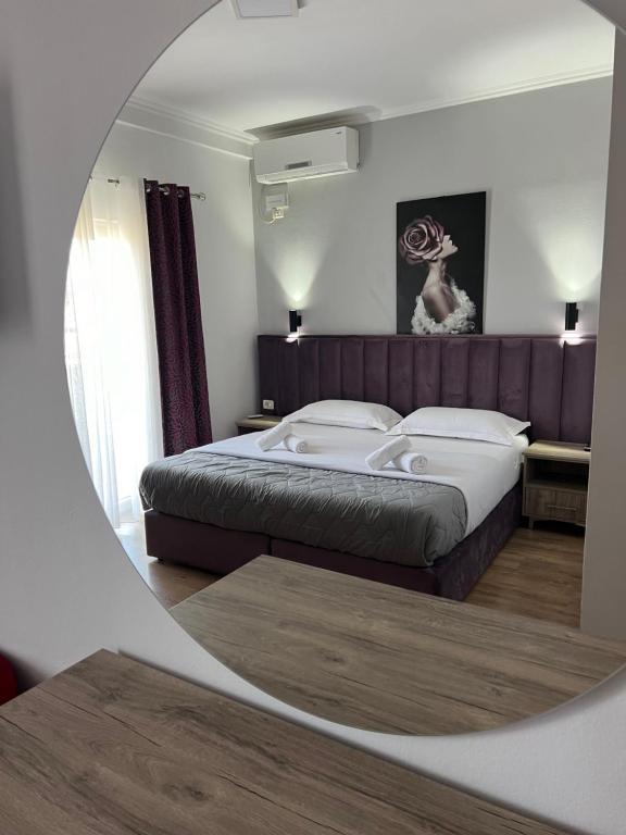 Postel nebo postele na pokoji v ubytování Hotel Floga