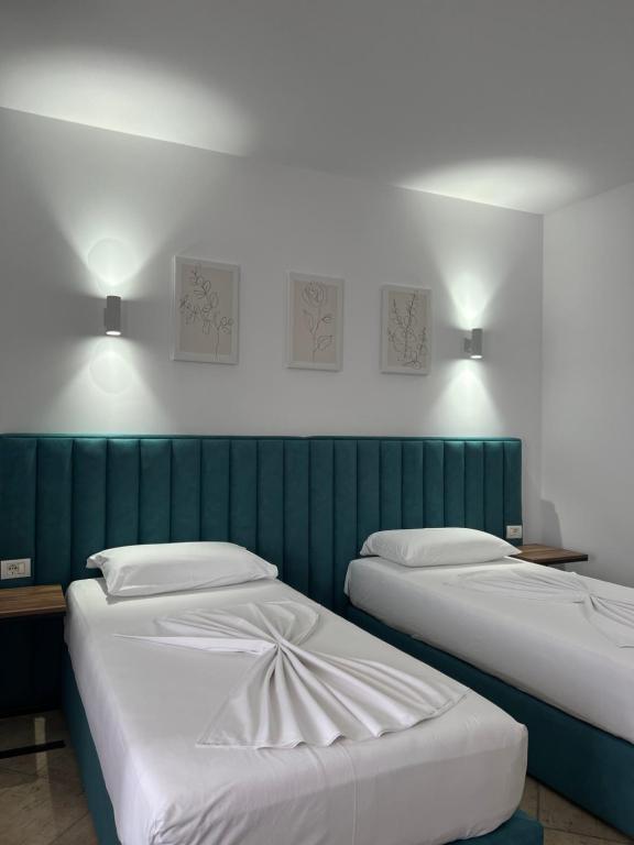 Postel nebo postele na pokoji v ubytování Hotel Floga