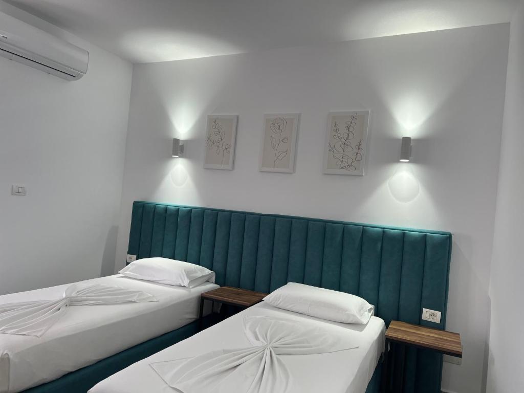 Postel nebo postele na pokoji v ubytování Hotel Floga