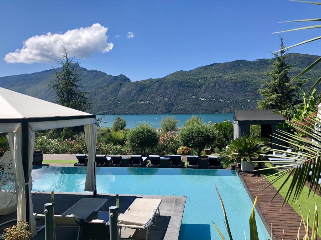 a swimming pool with a view of a mountain at Les Suites du Lac in Aix-les-Bains