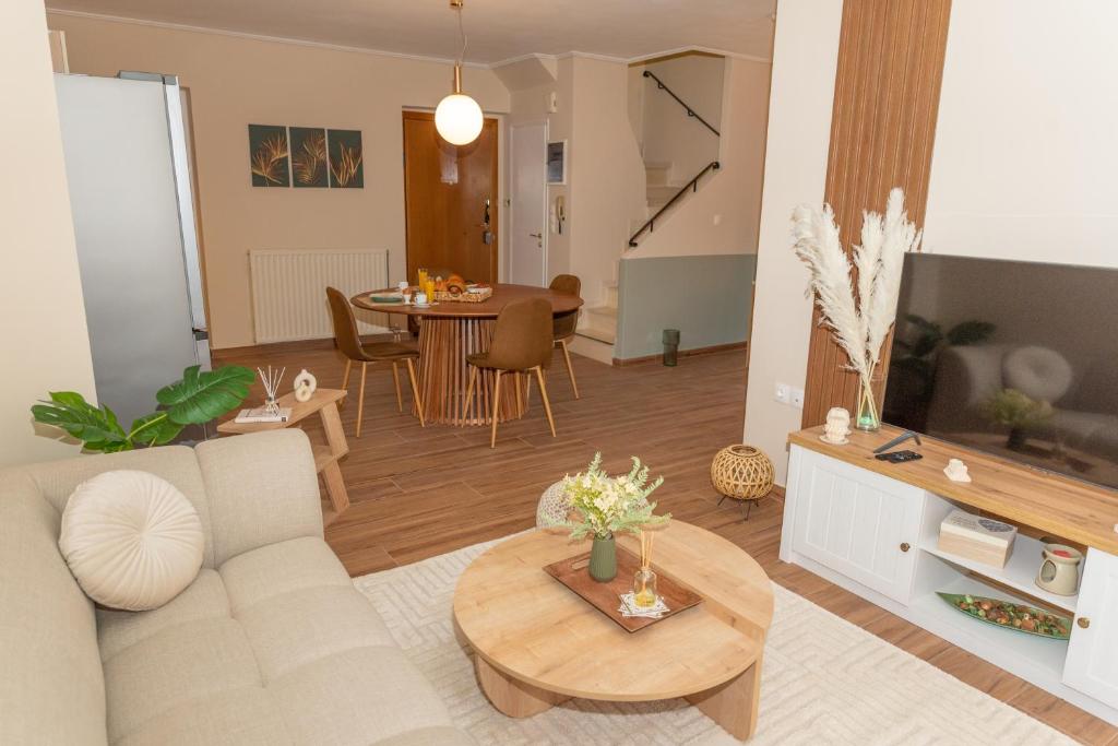 TV a/nebo společenská místnost v ubytování Athena Cocooning Apartment