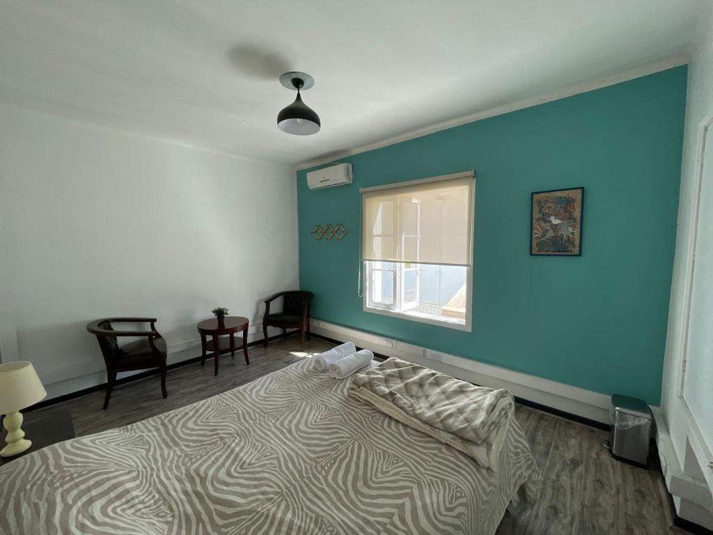 Ένα ή περισσότερα κρεβάτια σε δωμάτιο στο Casa Blanca