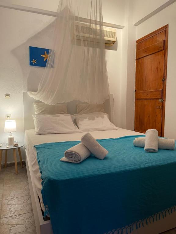 Voodi või voodid majutusasutuse Traditional Cycladic Home by the sea toas