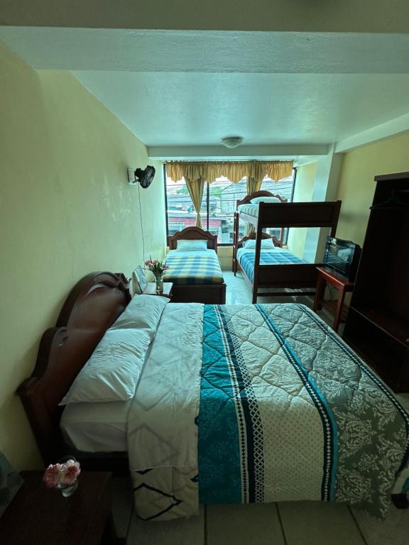 Postel nebo postele na pokoji v ubytování Kanoas Hostal