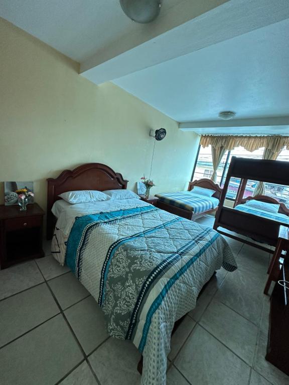 Postel nebo postele na pokoji v ubytování Kanoas Hostal