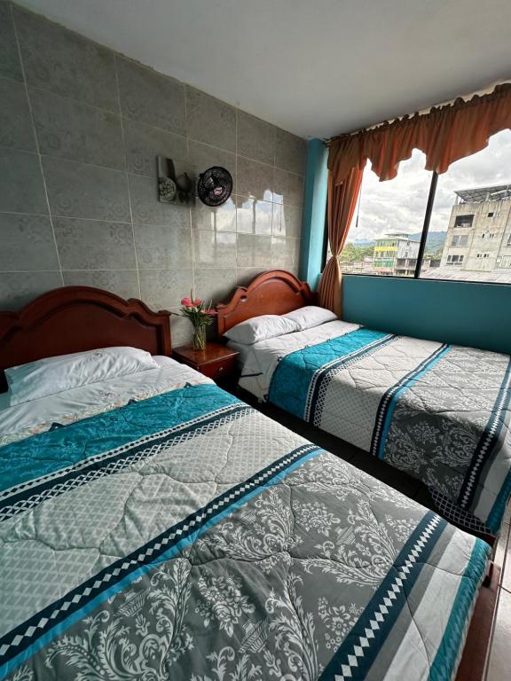 Postel nebo postele na pokoji v ubytování Kanoas Hostal