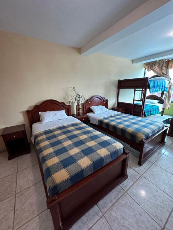 Postel nebo postele na pokoji v ubytování Kanoas Hostal