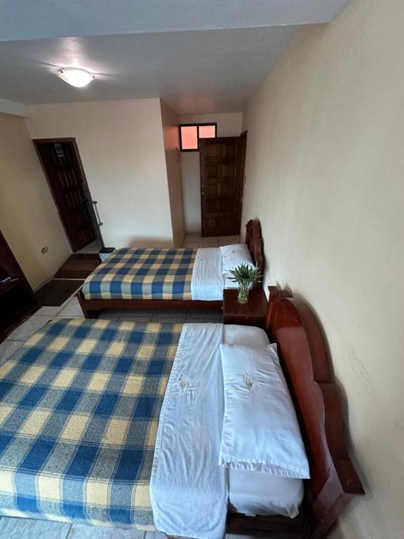 Postel nebo postele na pokoji v ubytování Kanoas Hostal
