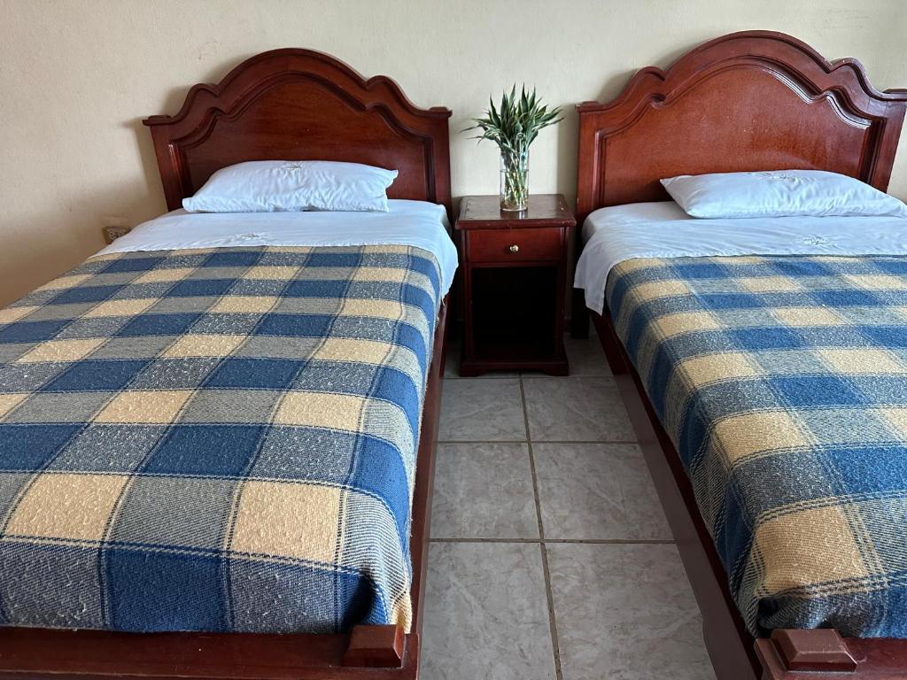 Postel nebo postele na pokoji v ubytování Kanoas Hostal