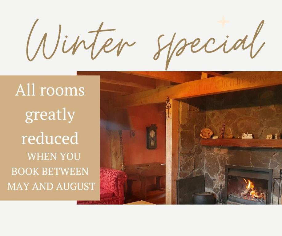 an image of a fireplace with the words winter special at Streamside Country Manor in Walton