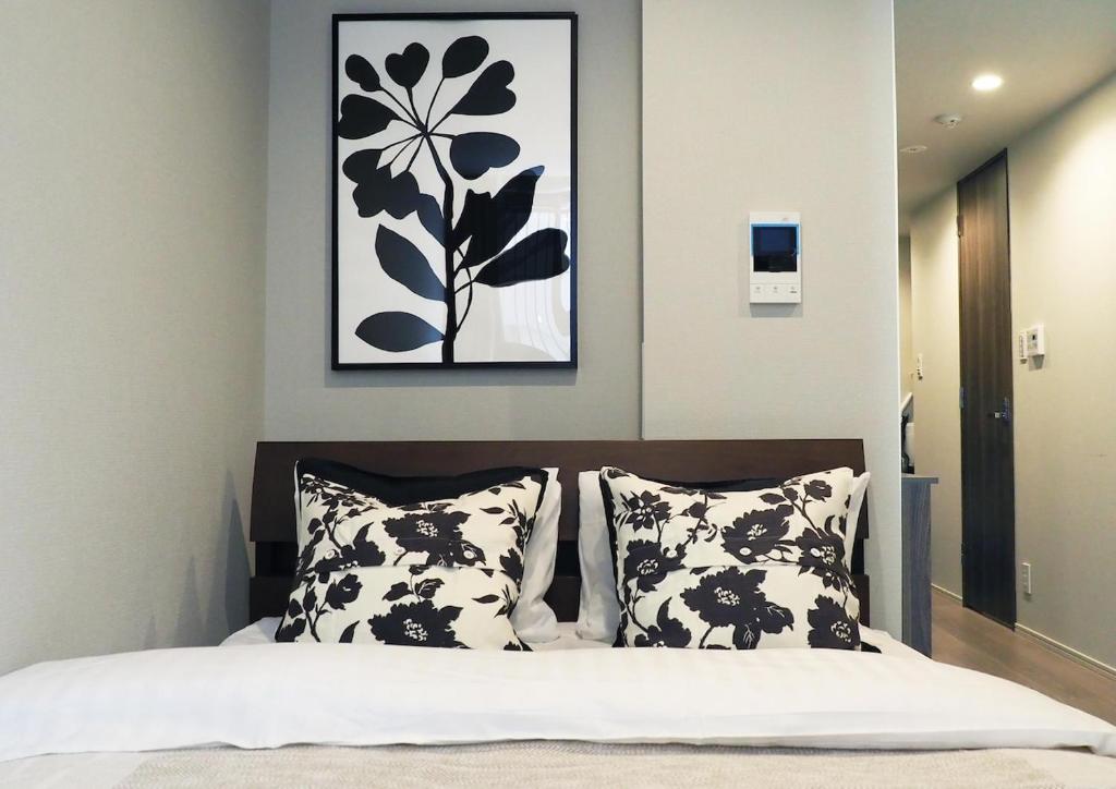 Ένα ή περισσότερα κρεβάτια σε δωμάτιο στο LANG Hotel Kameido#Near Akihabara#チェックアウトのみ清掃あり