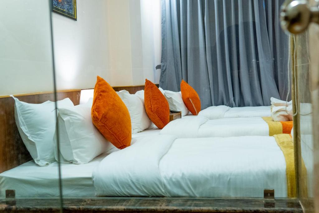 Postel nebo postele na pokoji v ubytování Hotel Yakroo Manang