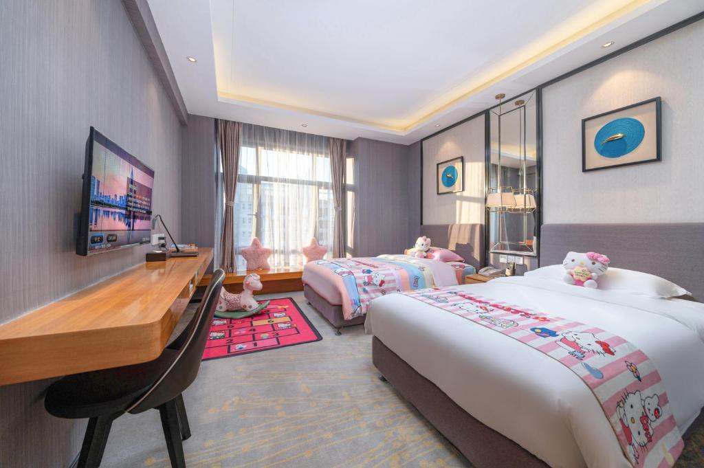 Postel nebo postele na pokoji v ubytování Sun Garden Hotel
