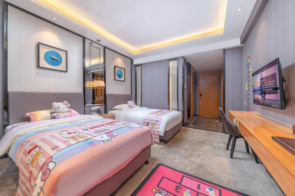 Postel nebo postele na pokoji v ubytování Sun Garden Hotel