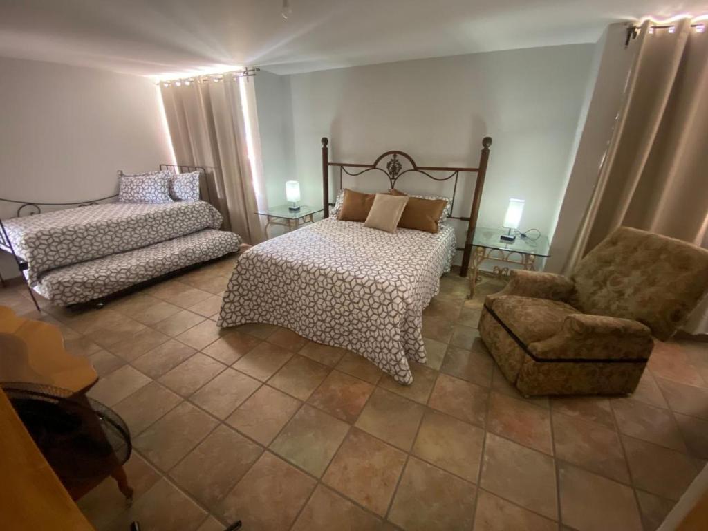 En eller flere senge i et værelse på Casa las Trojes