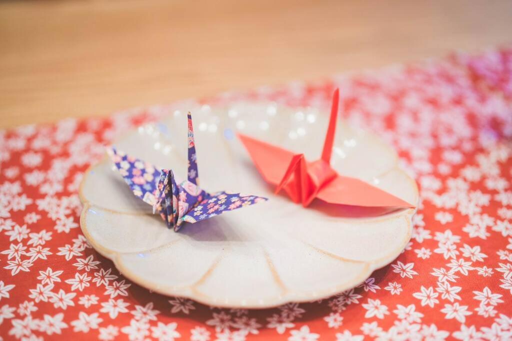 a cake with two paper boats on top of it at New! Kamata close Haneda AP - Traditional & Hot Spring in Tokyo