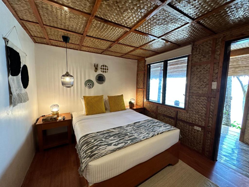 Postel nebo postele na pokoji v ubytování Beach Huts El Nido