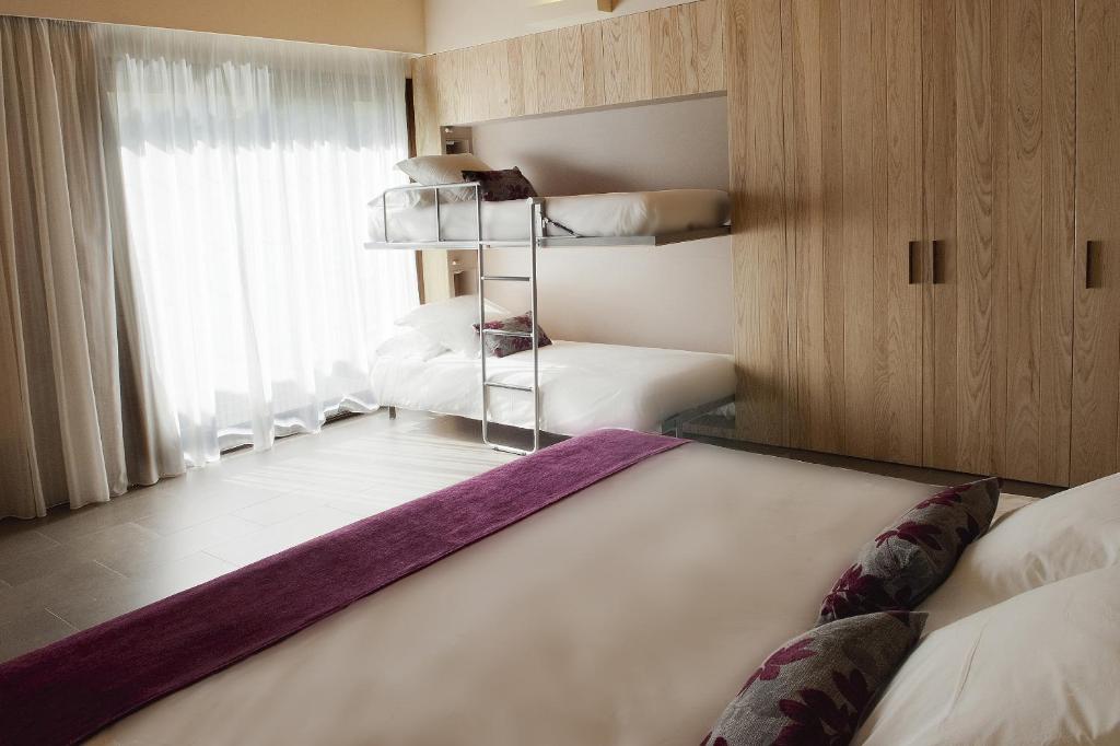 Posteľ alebo postele v izbe v ubytovaní Hotel El Molí
