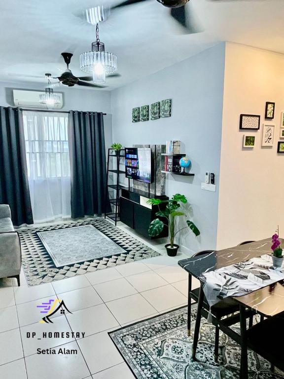 a living room with a couch and a table at DP Islamic Homestay in Setia Alam