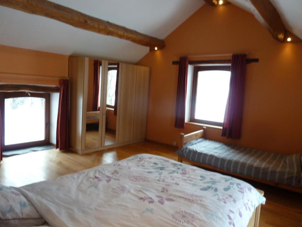 Postel nebo postele na pokoji v ubytování gîte Le cheval ardennais