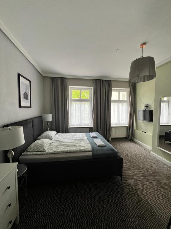 Postel nebo postele na pokoji v ubytování CIENISTA 7 APARTMENTS