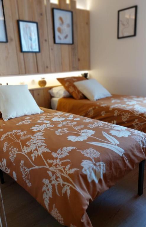 Letto o letti in una camera di Gite Au pommier fleuri et son "Appart" indépendant