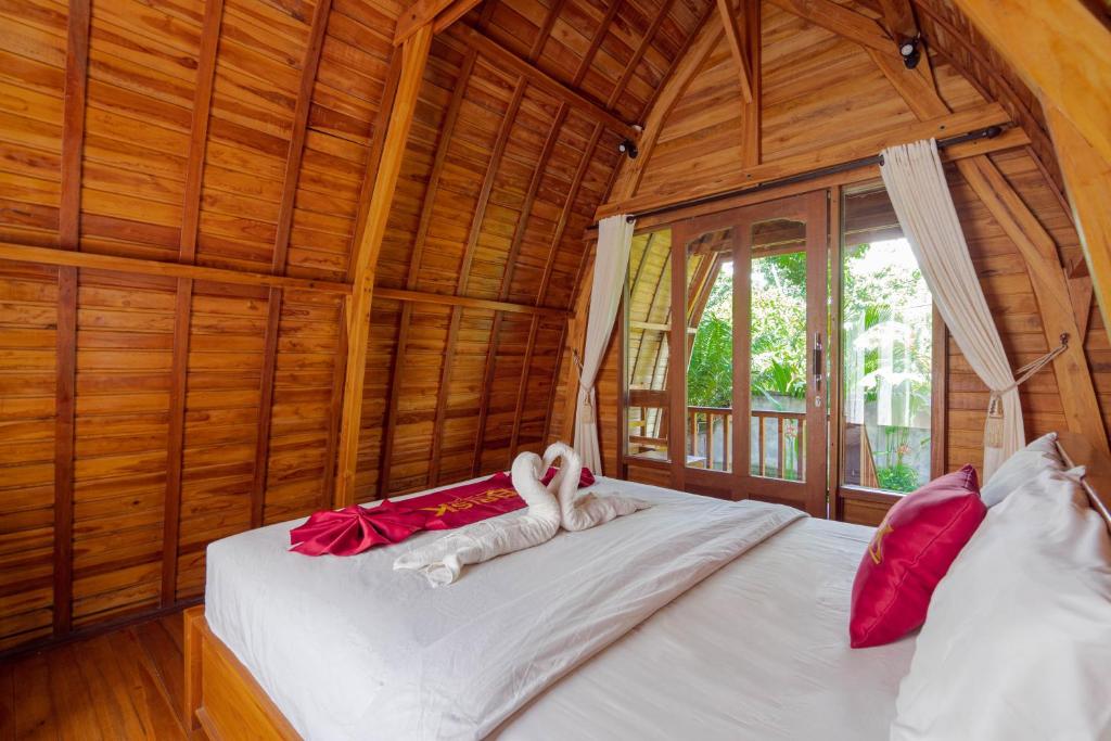 Postel nebo postele na pokoji v ubytování Brisk Homestay Uluwatu RedPartner