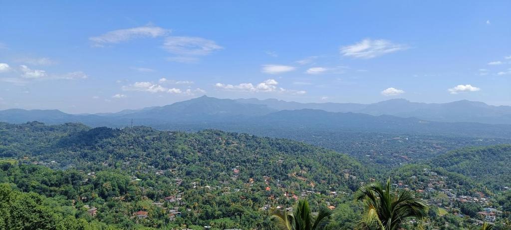 a view of a valley with mountains and forests at 259 Residencies in Kandy
