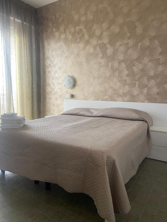 Postel nebo postele na pokoji v ubytování Hotel Re Leone