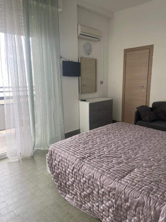 Postel nebo postele na pokoji v ubytování Hotel Re Leone