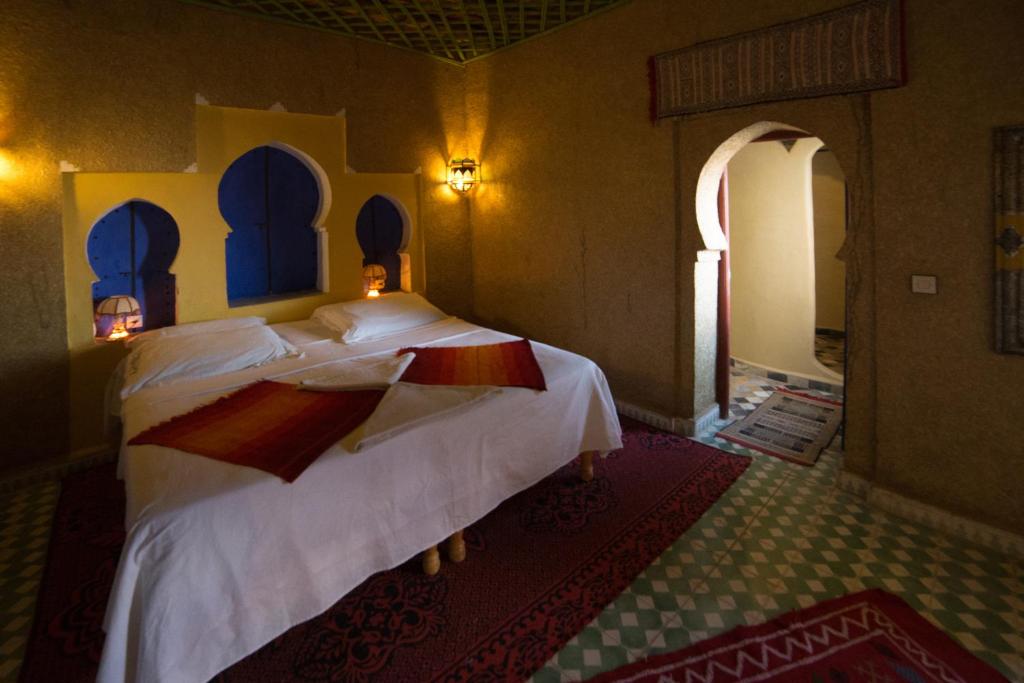 Postel nebo postele na pokoji v ubytování Kasbah Hotel Panorama