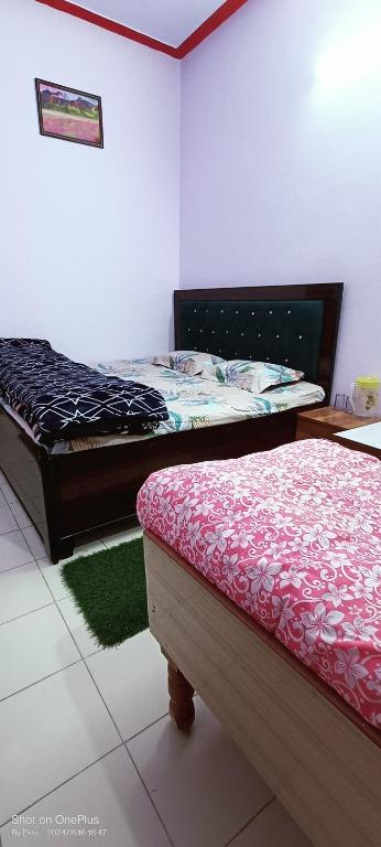 Postel nebo postele na pokoji v ubytování Abhishek guest house