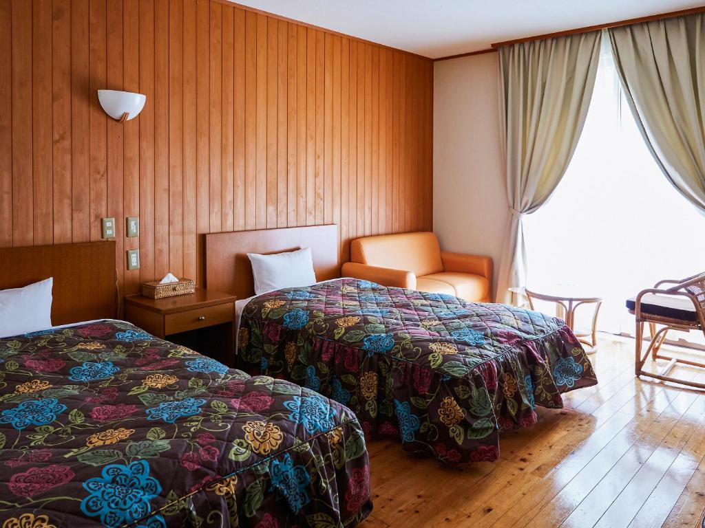 Postel nebo postele na pokoji v ubytování 宝泉坊ロッジ