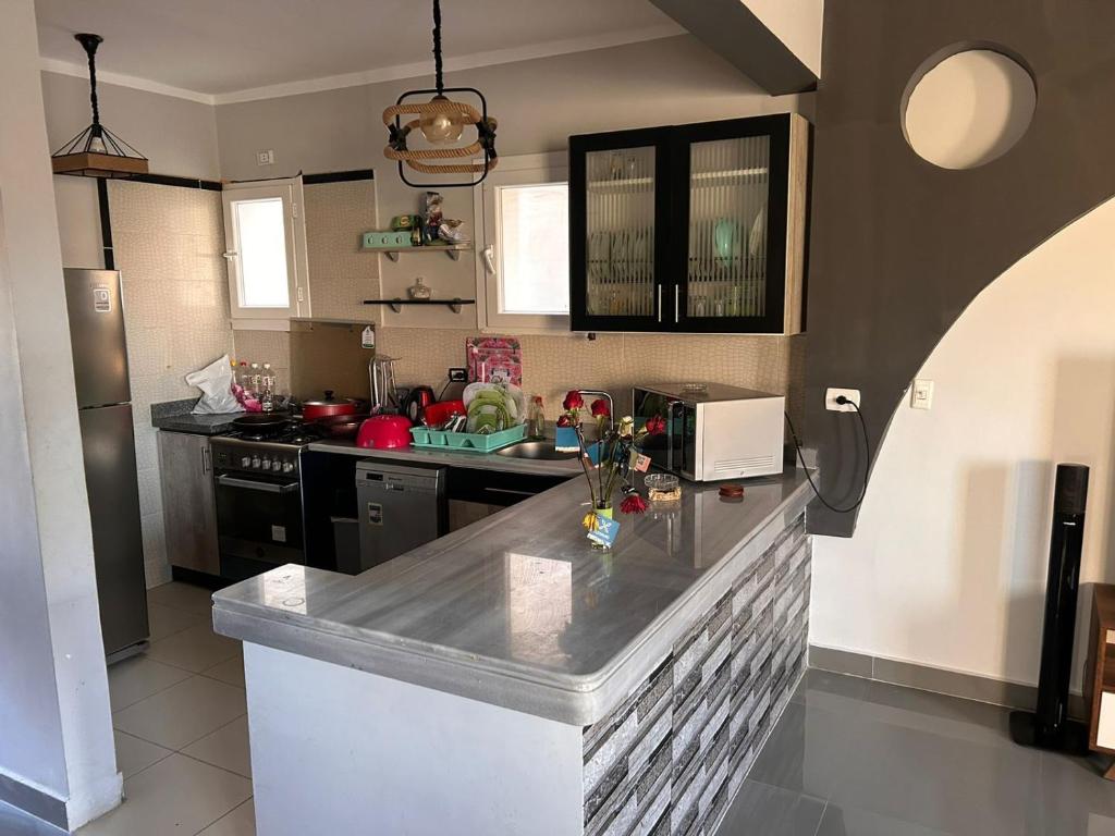 A kitchen or kitchenette at Fancy sea view villa with private jacuzzi mountain view north coast Bait Karim - Twin Villa with roof & juccuzi