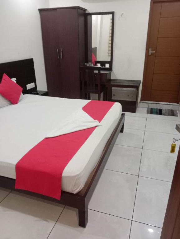 Postel nebo postele na pokoji v ubytování Grace Tourist Home