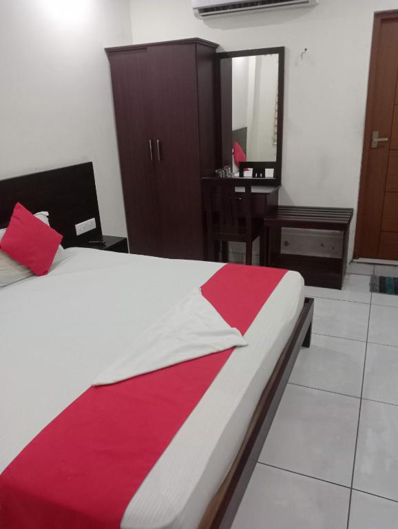 Postel nebo postele na pokoji v ubytování Grace Tourist Home