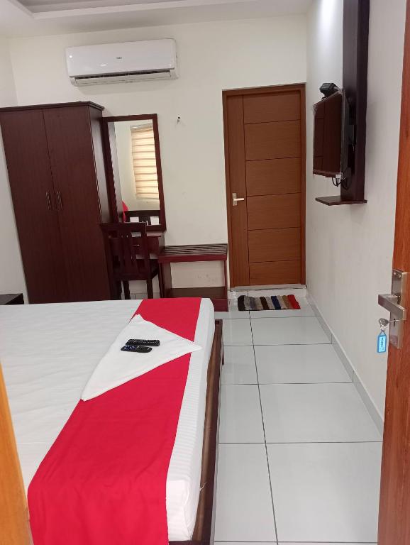 Postel nebo postele na pokoji v ubytování Grace Tourist Home