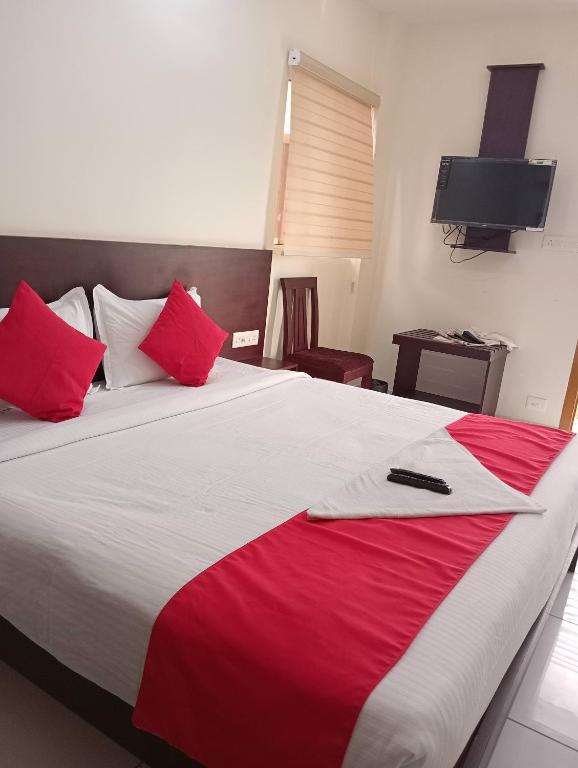 Postel nebo postele na pokoji v ubytování Grace Tourist Home
