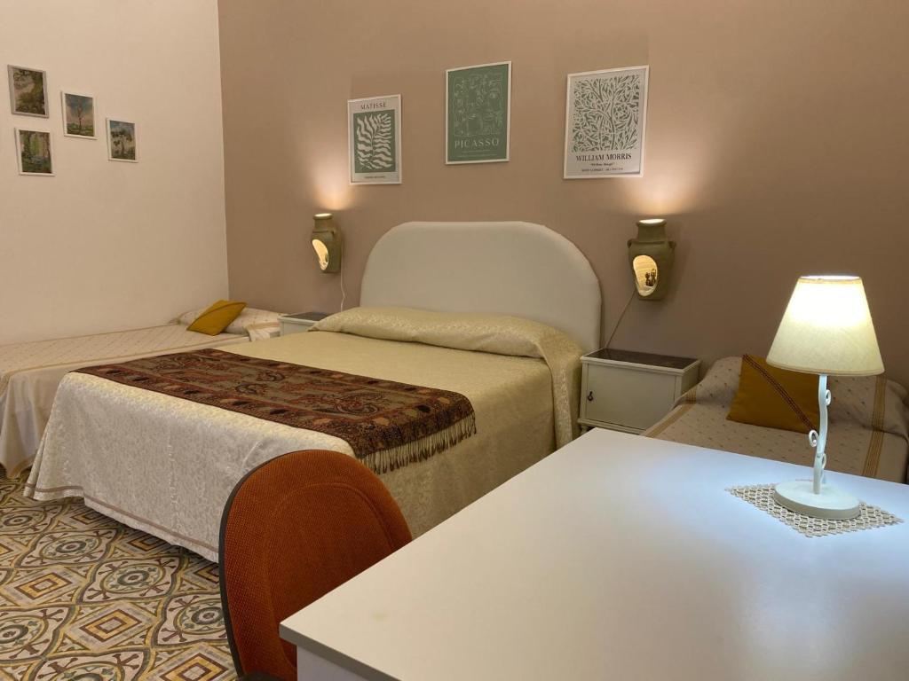 Posteľ alebo postele v izbe v ubytovaní La Casa dei Fiori