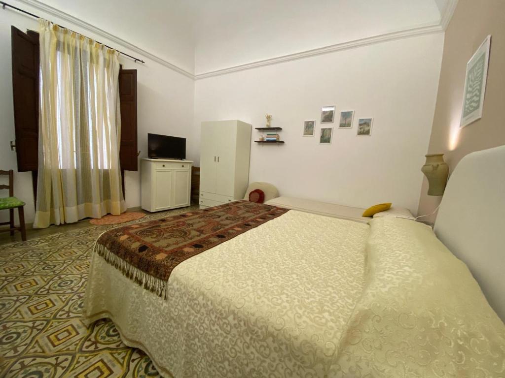 Posteľ alebo postele v izbe v ubytovaní La Casa dei Fiori