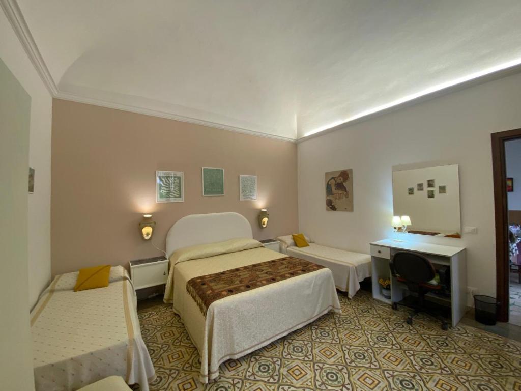 Posteľ alebo postele v izbe v ubytovaní La Casa dei Fiori